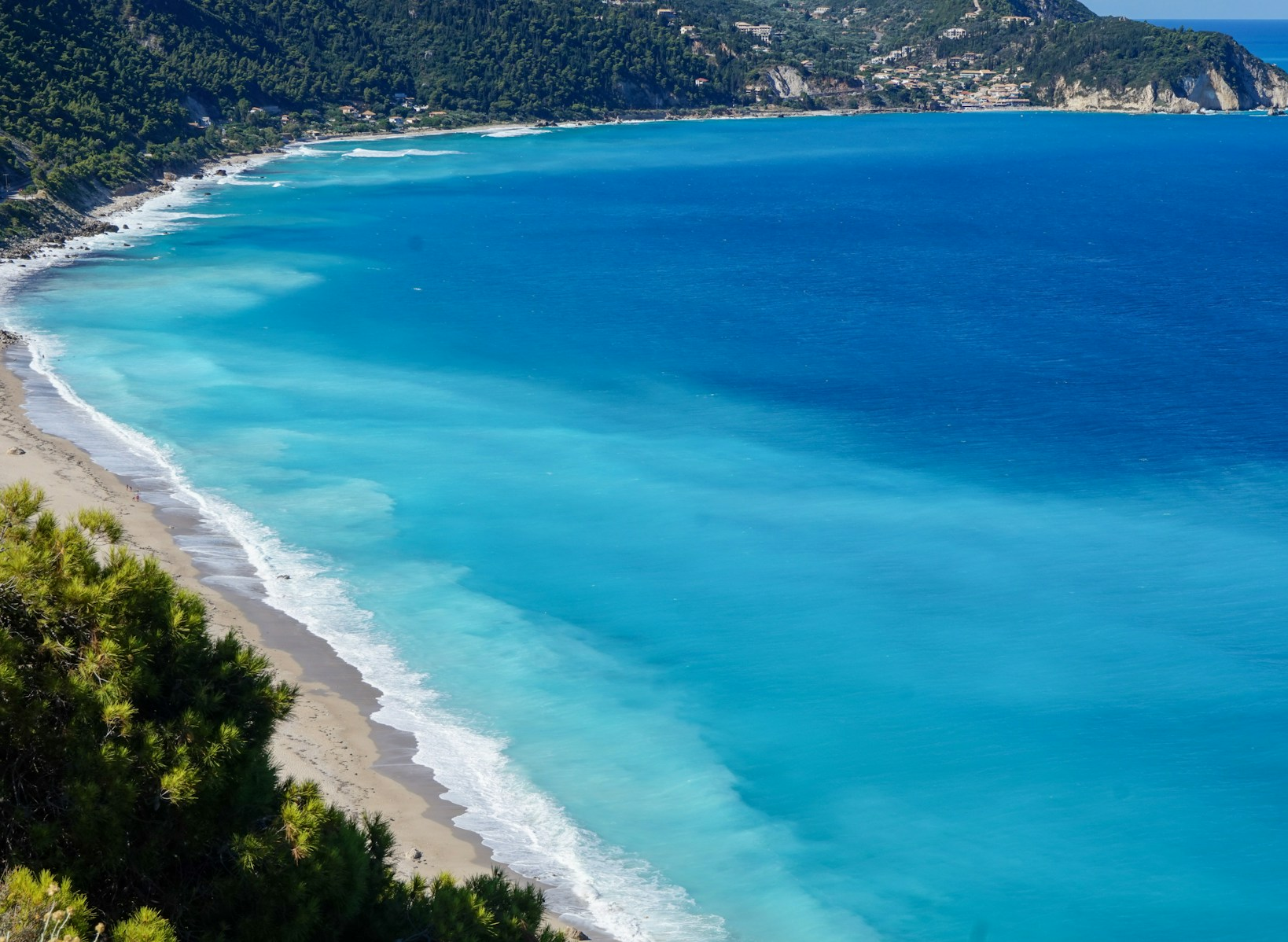 Turquoise sea and green coastline, from the Lefkada guest guide